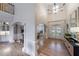 Bright foyer features hardwood floors, high ceilings, and arched entryways to dining and sitting rooms at 2101 Hunters Green Dr, Lawrenceville, GA 30043