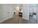 Carpeted hallway with access to bedrooms and closets, with neutral color palette at 2101 Hunters Green Dr, Lawrenceville, GA 30043