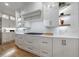 Kitchen with white cabinets, stainless steel appliances, tile backsplash, and hardwood floors at 2101 Hunters Green Dr, Lawrenceville, GA 30043