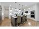 Bright kitchen featuring a large island with seating, pendant lights, and stainless steel appliances at 2101 Hunters Green Dr, Lawrenceville, GA 30043