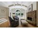 Living room with stone fireplace, vaulted ceilings and exterior views at 2101 Hunters Green Dr, Lawrenceville, GA 30043