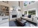 Bright living room with built-in shelving, fireplace, and large windows offering abundant natural light at 2101 Hunters Green Dr, Lawrenceville, GA 30043