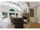 Bright living room with stone fireplace, vaulted ceilings, and built-in shelving at 2101 Hunters Green Dr, Lawrenceville, GA 30043