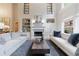 Inviting living room featuring fireplace, built-ins, and large windows offering backyard views at 2101 Hunters Green Dr, Lawrenceville, GA 30043