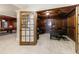 View from the doorway into a wood-paneled office with coffered ceilings and plush carpet at 2101 Hunters Green Dr, Lawrenceville, GA 30043