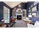 Beautiful study features a fireplace, built-in bookshelves, and large window at 2101 Hunters Green Dr, Lawrenceville, GA 30043