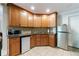 The wet bar features wooden cabinets, a counter, and a mini refrigerator at 2101 Hunters Green Dr, Lawrenceville, GA 30043