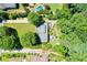 Bird's-eye view of a home with a landscaped yard and patio area, surrounded by lush greenery at 290 Dania Dr, Alpharetta, GA 30009