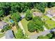 Aerial shot of a property with a swimming pool and well-manicured landscape on a sunny day at 290 Dania Dr, Alpharetta, GA 30009