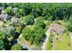 Aerial view of a residential area with lush greenery, homes, and well-maintained lawns in a desirable neighborhood at 290 Dania Dr, Alpharetta, GA 30009