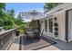Back deck with a table and chairs and an entrance to the home through French doors at 290 Dania Dr, Alpharetta, GA 30009