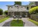 Inviting backyard with an outdoor table and chairs, flowers and meticulous landscaping at 290 Dania Dr, Alpharetta, GA 30009