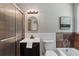Bathroom with stylish vanity, toilet, bathtub/shower, and a framed glass shower door at 290 Dania Dr, Alpharetta, GA 30009