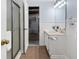 Cozy bathroom with tile floor, wainscoting, and shower with glass door at 290 Dania Dr, Alpharetta, GA 30009