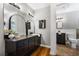 Bathroom featuring a vanity with drawers and a large arched mirror at 290 Dania Dr, Alpharetta, GA 30009