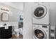 Bathroom with stylish vanity, toilet, bathtub/shower, and modern washer/dryer at 290 Dania Dr, Alpharetta, GA 30009