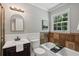 Bathroom with stylish vanity, toilet, bathtub/shower, and a bright window at 290 Dania Dr, Alpharetta, GA 30009