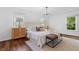 Bright bedroom with white bedding, hardwood floors, and natural light at 290 Dania Dr, Alpharetta, GA 30009