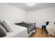 Bedroom featuring a metal frame bed, hardwood floors, and a chair at 290 Dania Dr, Alpharetta, GA 30009
