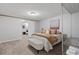 Cozy bedroom with neutral tones features a comfortable bed, bench, and convenient closet storage system at 290 Dania Dr, Alpharetta, GA 30009