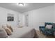 Comfortable bedroom featuring carpet, chair, and a large window at 290 Dania Dr, Alpharetta, GA 30009