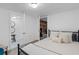 Bright bedroom with access to a mirrored dressing area, wood floors and comfortable bedding at 290 Dania Dr, Alpharetta, GA 30009