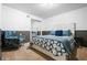 Bedroom featuring a white headboard, a patterned bedspread, a chair, and sliding closet doors at 290 Dania Dr, Alpharetta, GA 30009