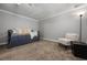 Bedroom featuring a daybed with white pillows and a chair at 290 Dania Dr, Alpharetta, GA 30009