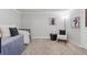 Comfortable bedroom with neutral decor features a daybed with stylish throw pillows and chair at 290 Dania Dr, Alpharetta, GA 30009