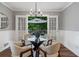 Dining area with glass table and chairs, open to patio and outdoor dining set at 290 Dania Dr, Alpharetta, GA 30009