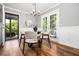 Cozy dining nook with wood floors and door to the outside patio at 290 Dania Dr, Alpharetta, GA 30009