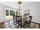 Bright dining room featuring a large bay window and modern chandelier above the table at 290 Dania Dr, Alpharetta, GA 30009
