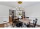 Open dining room with hardwood floors and natural light, perfect for entertaining guests at 290 Dania Dr, Alpharetta, GA 30009