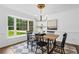Dining room with large bay window, hardwood floors, and modern chandelier at 290 Dania Dr, Alpharetta, GA 30009