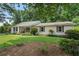 Traditional home with a well-kept lawn, offering a blend of classic charm and inviting curb appeal at 290 Dania Dr, Alpharetta, GA 30009