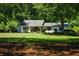 Charming one-story home with manicured front lawn and inviting porch, perfect for relaxing outdoors at 290 Dania Dr, Alpharetta, GA 30009