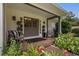 Charming front porch with double doors, comfortable seating, and lush greenery, offering a welcoming entry at 290 Dania Dr, Alpharetta, GA 30009
