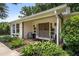 Inviting front porch with double doors, tasteful landscaping, and cozy seating, creating a welcoming entrance at 290 Dania Dr, Alpharetta, GA 30009