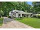 Ranch style home with front yard, covered front porch at 290 Dania Dr, Alpharetta, GA 30009