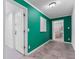 Hallway with emerald green accent wall, and view to a serene bedroom at 290 Dania Dr, Alpharetta, GA 30009