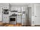 Updated kitchen with stainless steel appliances and gray painted cabinets at 290 Dania Dr, Alpharetta, GA 30009
