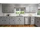 Well-lit kitchen with stainless steel appliances, gray cabinets, and granite countertops at 290 Dania Dr, Alpharetta, GA 30009