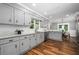 Kitchen with stainless steel appliances, white cabinets and eat in breakfast area at 290 Dania Dr, Alpharetta, GA 30009