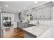 Updated kitchen featuring white cabinets, granite countertops, and stainless steel appliances at 290 Dania Dr, Alpharetta, GA 30009