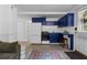 Compact kitchenette with dark blue cabinets and dining area at 290 Dania Dr, Alpharetta, GA 30009