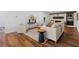 Bright living room featuring hardwood floors and a white brick fireplace with an open concept design at 290 Dania Dr, Alpharetta, GA 30009