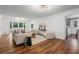 Spacious living room with French doors, modern furnishings, and views of the backyard at 290 Dania Dr, Alpharetta, GA 30009