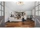 Living room with wood floors, neutral furniture, fireplace, and a unique light fixture at 290 Dania Dr, Alpharetta, GA 30009