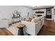 Comfortable living room with a white brick fireplace, hardwood floors, and stylish decor at 290 Dania Dr, Alpharetta, GA 30009