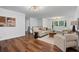Cozy living room featuring natural light, hardwood floors, and comfortable seating area at 290 Dania Dr, Alpharetta, GA 30009